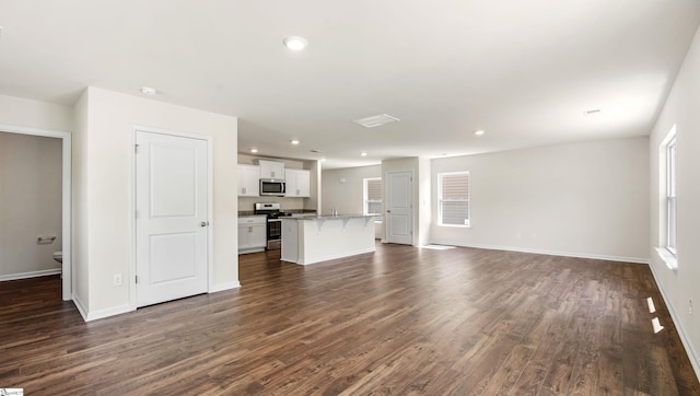 634 Evaleigh St, Woodruff, SC 29388 - unfurnished living room featuring baseboards, recessed lighting, and dark wood-style floors