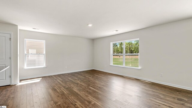 634 Evaleigh St, Woodruff, SC 29388 - unfurnished room with dark wood-style flooring and baseboards