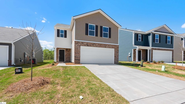 634 Evaleigh St, Woodruff, SC 29388 - traditional-style home with a garage, concrete driveway, a front lawn, and brick siding