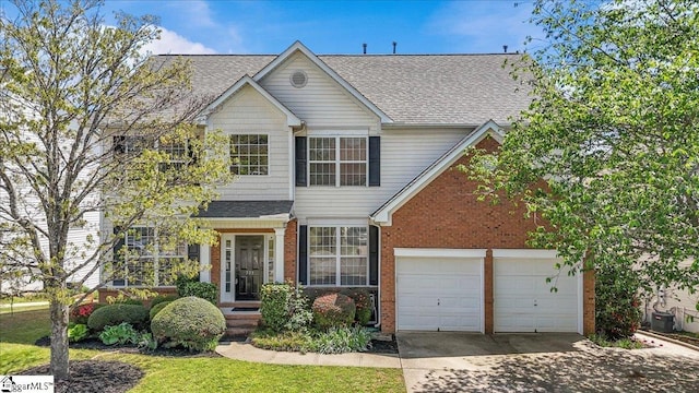 traditional home with brick siding, driveway, and a shingled roof