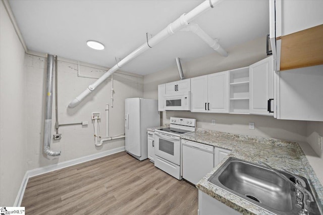 kitchen featuring open shelves, a sink, light wood-type flooring, white appliances, and white cabinetry