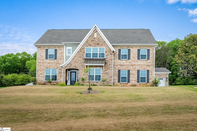 view of front facade featuring brick siding, a front lawn, a shingled roof, and an attached garage