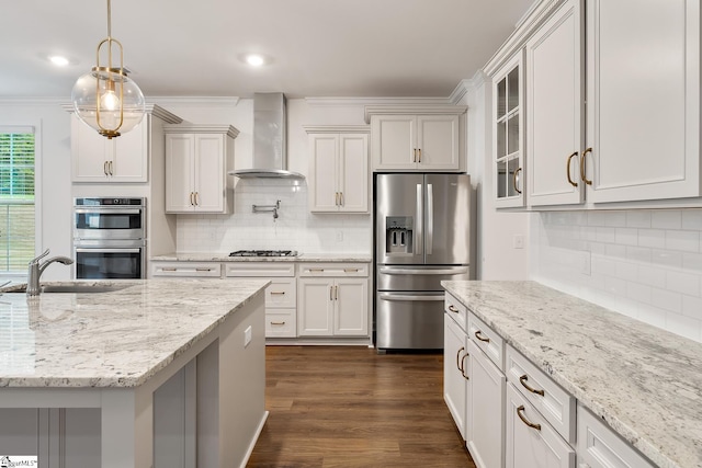 kitchen featuring glass insert cabinets, backsplash, dark wood-type flooring, wall chimney exhaust hood, and appliances with stainless steel finishes