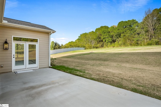 view of patio / terrace featuring fence