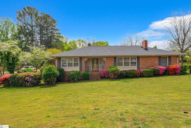 1 Hardy St, Williamston, SC 29697 - ranch-style house featuring brick siding, a front lawn, and a chimney