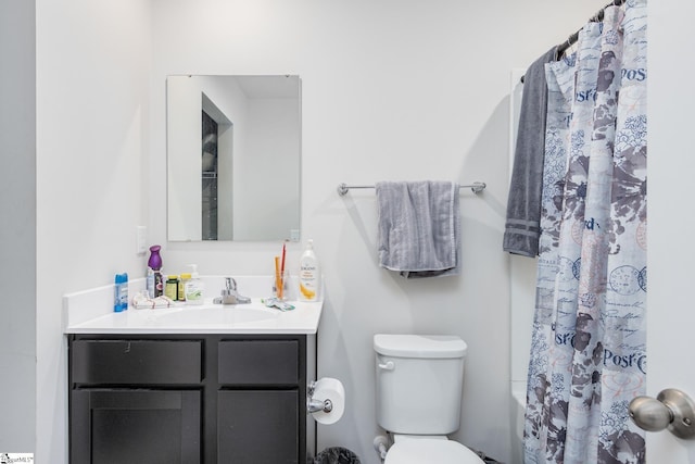 full bathroom featuring toilet and vanity