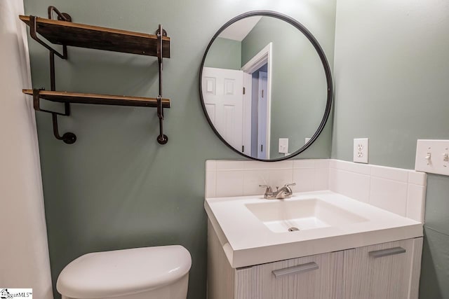 350 Hamilton Pkwy, Easley, SC 29642 - bathroom featuring vanity, toilet, and decorative backsplash