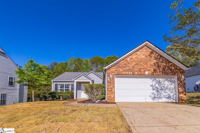 350 Hamilton Pkwy, Easley, SC 29642 - view of front facade featuring brick siding, a front lawn, an attached garage, and driveway