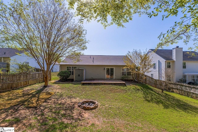 350 Hamilton Pkwy, Easley, SC 29642 - rear view of house featuring a yard, a fenced backyard, a wooden deck, and a fire pit