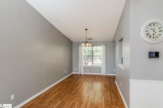 350 Hamilton Pkwy, Easley, SC 29642 - unfurnished dining area with a chandelier, wood finished floors, and baseboards