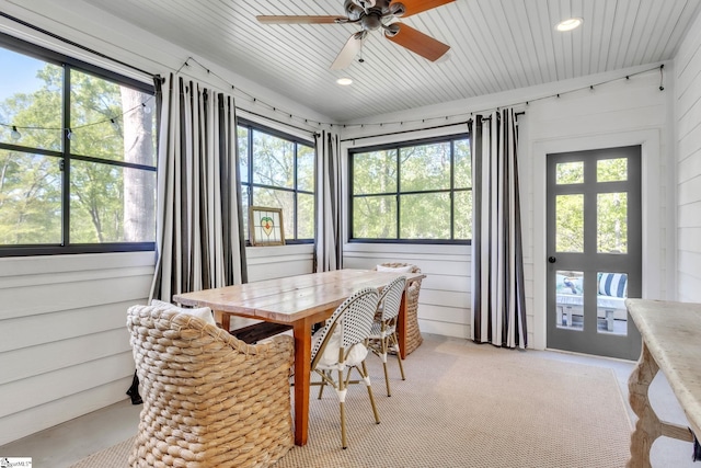sunroom / solarium featuring a ceiling fan and plenty of natural light
