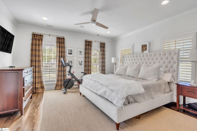 bedroom featuring crown molding, wood finished floors, visible vents, and recessed lighting