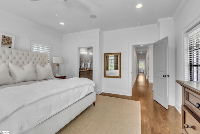 bedroom featuring crown molding, baseboards, recessed lighting, and wood finished floors