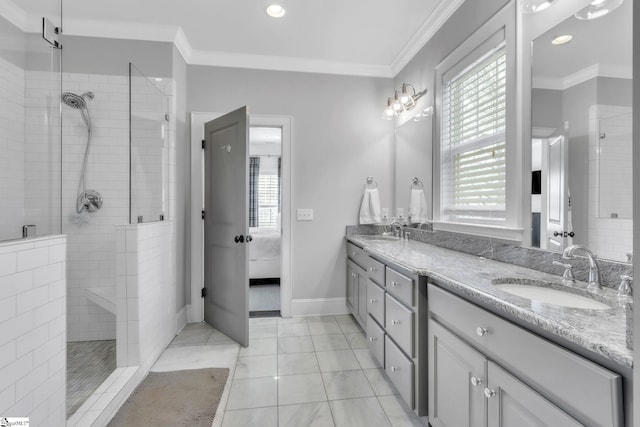 ensuite bathroom with a sink, a wealth of natural light, crown molding, ensuite bath, and tiled shower