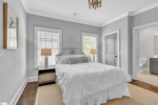 bedroom with visible vents, baseboards, ornamental molding, and dark wood finished floors