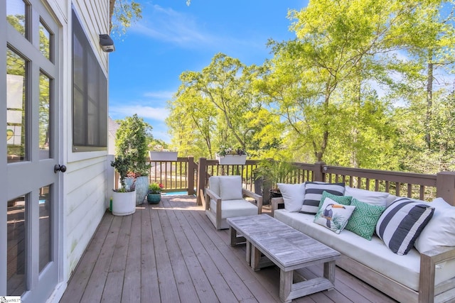 wooden deck featuring outdoor lounge area