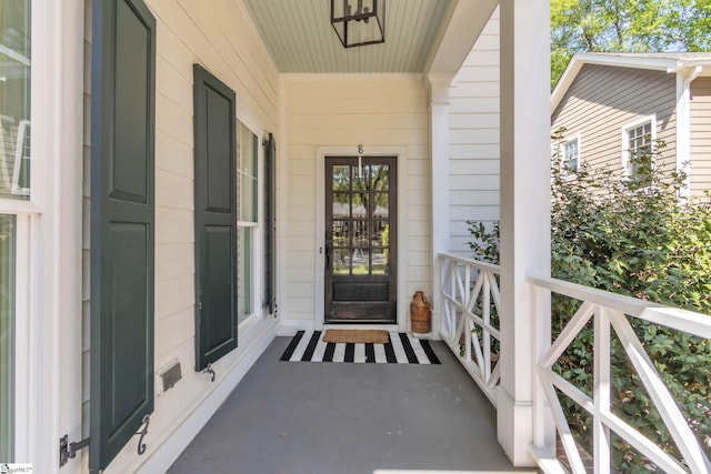 doorway to property with a porch