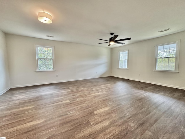 102 Buckingham Ct, Easley, SC 29640 - empty room featuring visible vents, dark wood-style flooring, ceiling fan, and baseboards