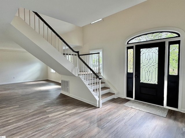 102 Buckingham Ct, Easley, SC 29640 - foyer entrance featuring visible vents, baseboards, wood finished floors, and stairway