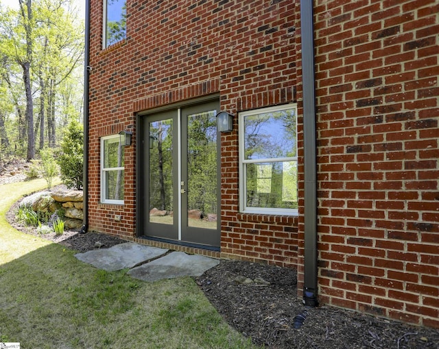 property entrance with brick siding