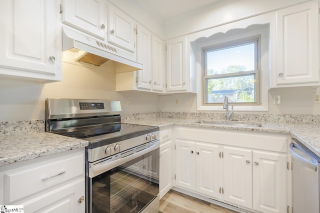 309 Frank St, Easley, SC 29642 - kitchen with dishwasher, a sink, stainless steel electric stove, under cabinet range hood, and white cabinetry