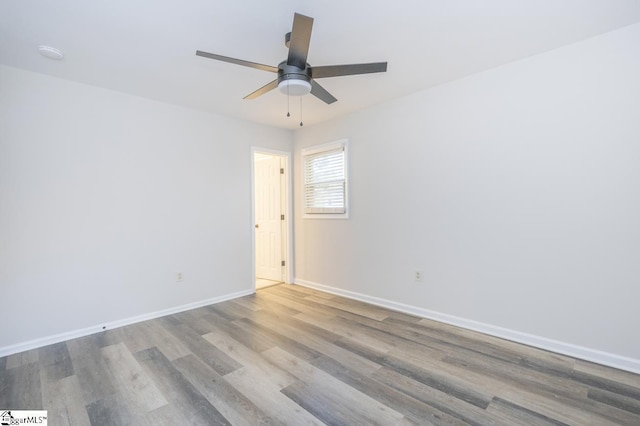 309 Frank St, Easley, SC 29642 - spare room featuring wood finished floors, baseboards, and a ceiling fan