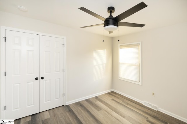 309 Frank St, Easley, SC 29642 - unfurnished bedroom with a closet, visible vents, baseboards, and wood finished floors