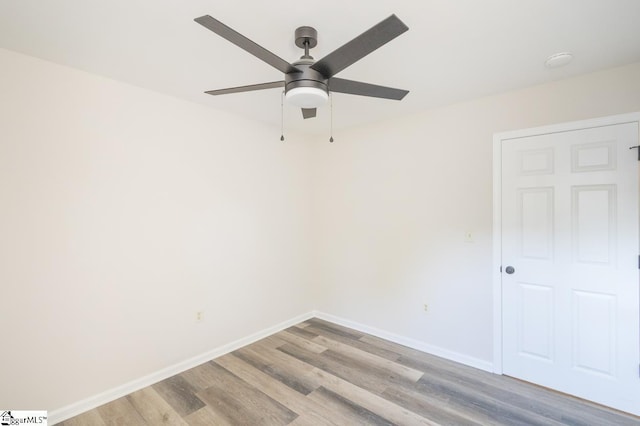 309 Frank St, Easley, SC 29642 - empty room with ceiling fan, light wood finished floors, and baseboards