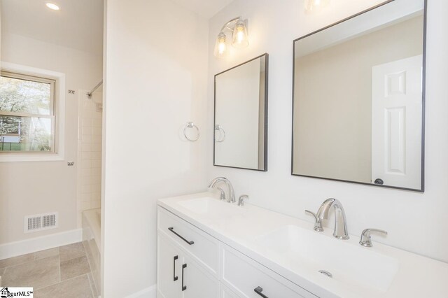 309 Frank St, Easley, SC 29642 - full bath featuring double vanity, visible vents, baseboards, and a sink