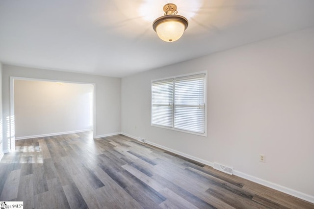 309 Frank St, Easley, SC 29642 - unfurnished room featuring visible vents, baseboards, and wood finished floors