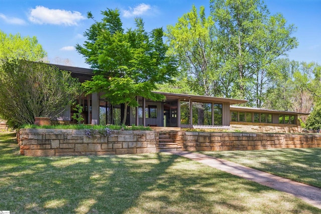 view of community featuring a lawn
