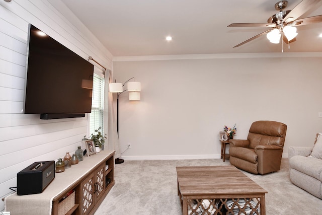 carpeted living room featuring crown molding, baseboards, a ceiling fan, and recessed lighting