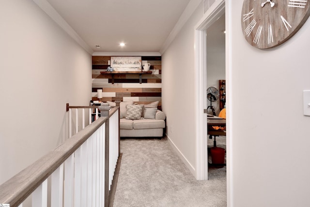 hall with crown molding, an upstairs landing, light colored carpet, and recessed lighting