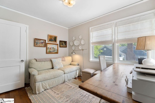living room featuring ornamental molding and wood finished floors