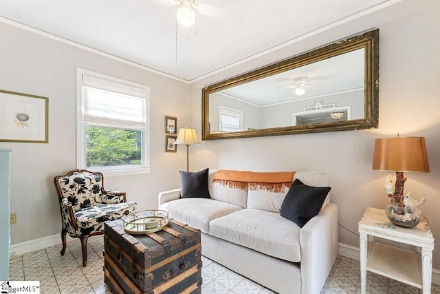 living room featuring baseboards, crown molding, and ceiling fan