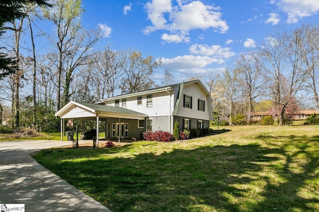 302 Pamela Ln, Laurens, SC 29360 - view of side of home with a carport, a yard, and driveway