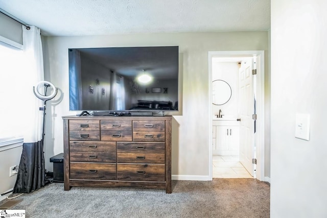 302 Pamela Ln, Laurens, SC 29360 - bedroom featuring baseboards, carpet flooring, connected bathroom, and a textured ceiling