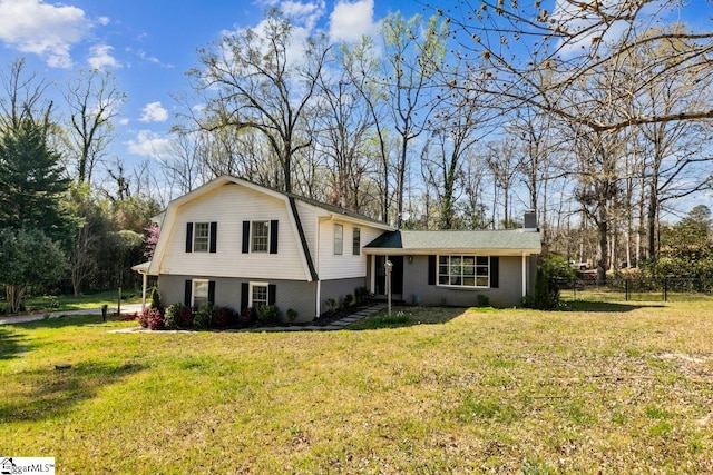 302 Pamela Ln, Laurens, SC 29360 - tri-level home featuring a front lawn, fence, a gambrel roof, and a chimney