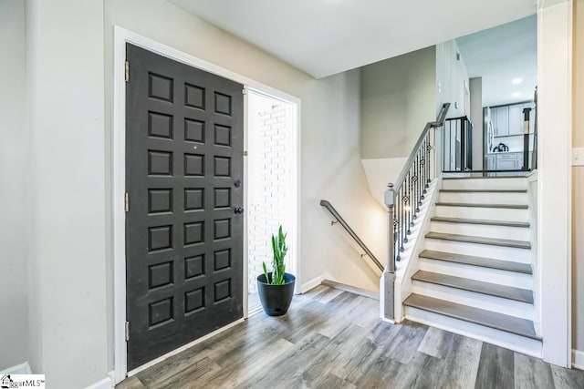 302 Pamela Ln, Laurens, SC 29360 - entrance foyer featuring wood finished floors, baseboards, and stairway