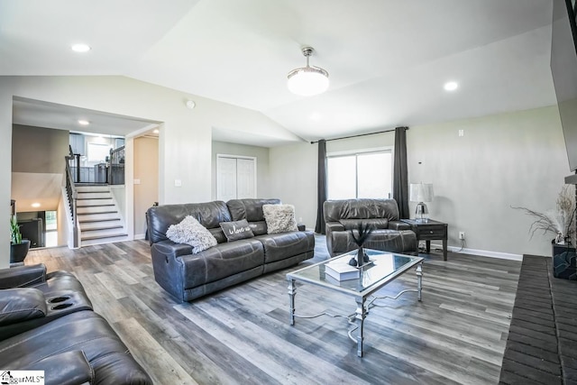302 Pamela Ln, Laurens, SC 29360 - living area featuring stairs, wood finished floors, and lofted ceiling