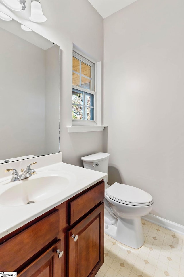 half bath with toilet and vanity