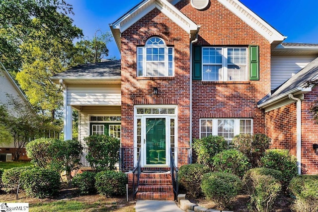 view of front of home with brick siding