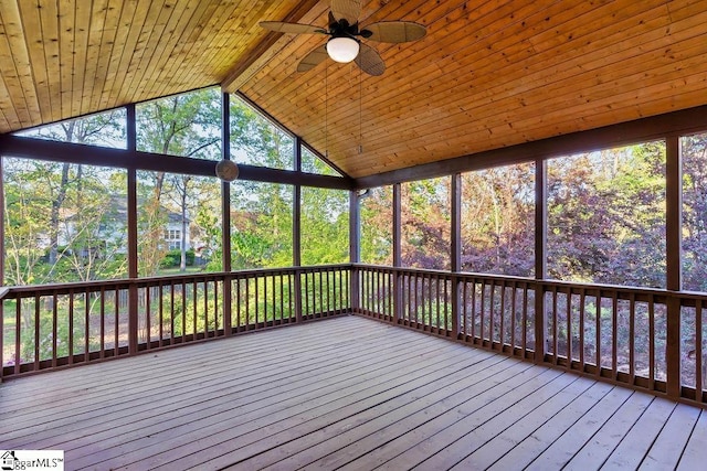 unfurnished sunroom featuring a ceiling fan