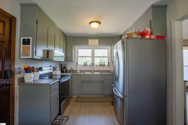 4041 N 101st Hwy, Greer, SC 29651 - kitchen with a sink, gray cabinets, appliances with stainless steel finishes, and light wood finished floors