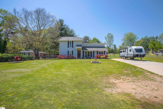 4041 N 101st Hwy, Greer, SC 29651 - view of front facade with a front lawn, fence, and concrete driveway