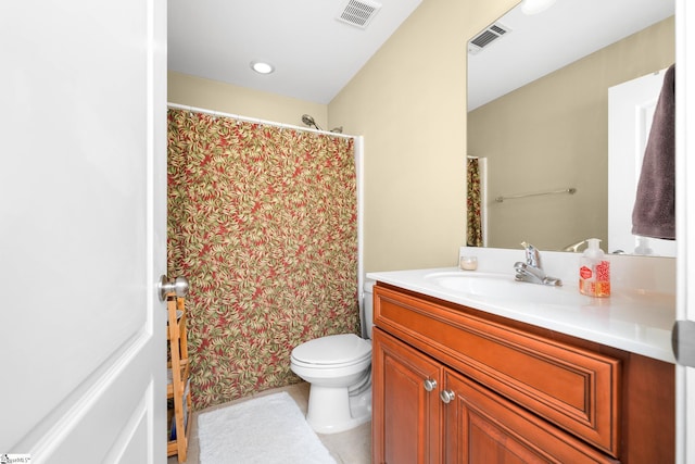 full bath with visible vents, toilet, vanity, and tile patterned floors