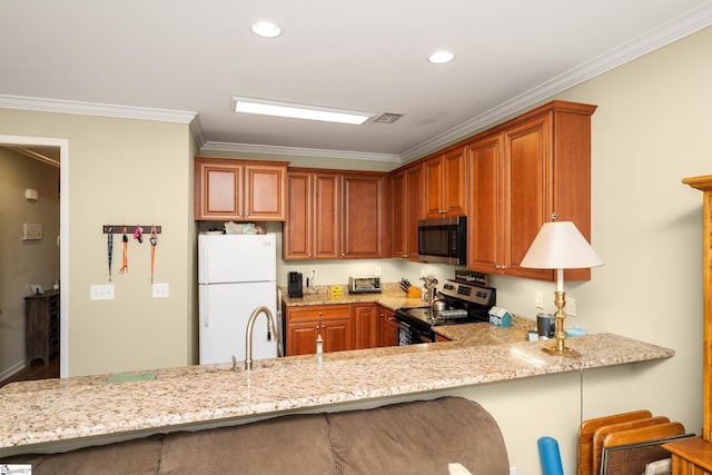 kitchen featuring visible vents, ornamental molding, a breakfast bar, light stone countertops, and stainless steel appliances