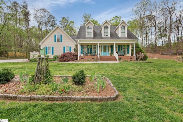 cape cod-style house with crawl space, covered porch, and a front lawn