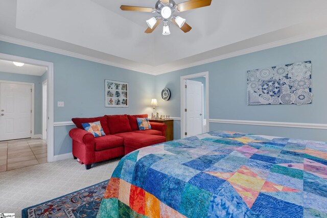 bedroom with baseboards, ornamental molding, a ceiling fan, carpet floors, and tile patterned floors