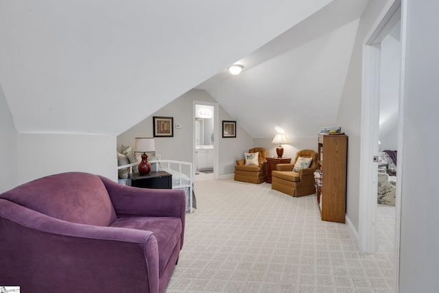living area with light carpet, baseboards, and lofted ceiling